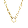 picture of a gold paper clip chain style necklace with a circle connector at the center